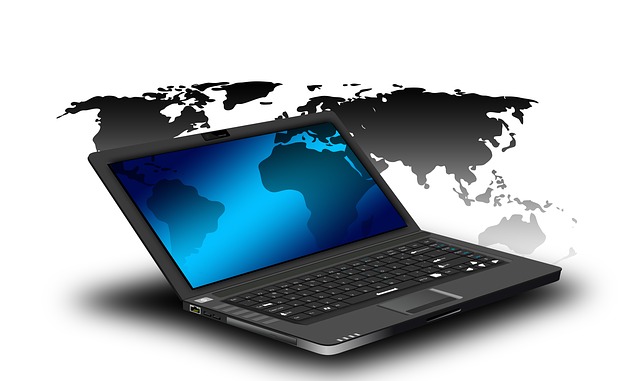 Black Laptop in front of world map
