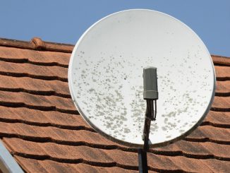 Satellite dish on house roof